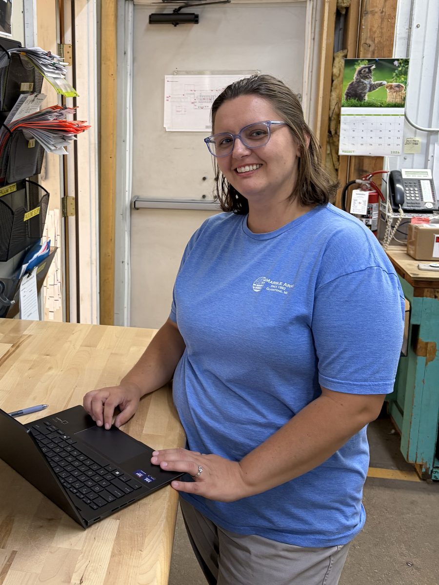 A Marble Arms purchasing lead entering orders on a laptop